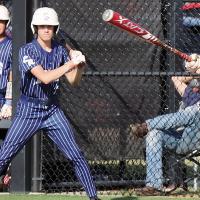 Austin Steffler (33) slaps the ball into the outfield