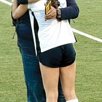 Conley Knapp gives Glen Miller a hug