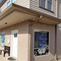 The front of Ezell’s Refrigeration with new window signage