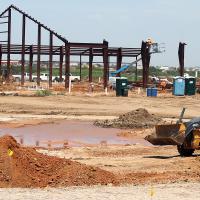 Crews have begun raising steel at the site of the new CC Fairgrounds