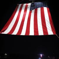 First responders hung a large American flag over I-40