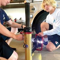 Parker Crosby (left) shows John Thompson how to use the jaws of life