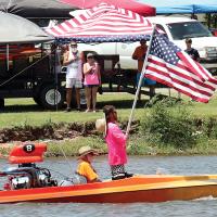A.J. Finnigan holds up the American flag
