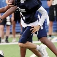 Chiloh Whiteshirt finds some open room behind blockers for extra yards