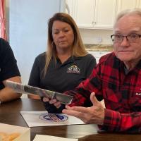Bill Tempero, right, makes a point while Wes and Chrystal Shivers listen