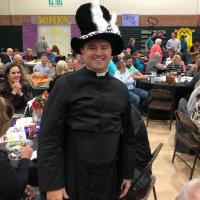 Father Corey Stanley got stuck with the hat