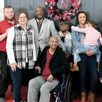 Fred Slaughter (in gray jacket) celebrated his induction with family