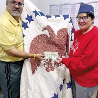 Nancy Salsman passes over the $200 bid