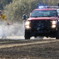 ER firefigher Josh Castrop sprays water