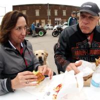 Leslie and Mike Fling eat onion fried burgers outside Johnnie’s