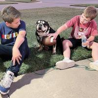 Jax and Colin Gore with their dog, Vanna