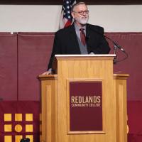 Jack Bryant speaks to the crowd at a graduation ceremony