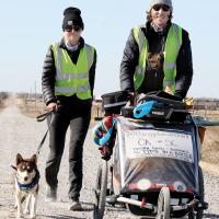 Matt Grooms and Grace Nesseth walk along Reno Road