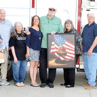George Bramlett presented a painting to honor local firefighters