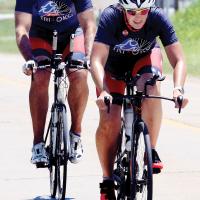 Sydney Haggins leads her husband Ryan up a hill on Route 66