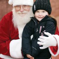 Haisley Haggerty grins for a photo with Santa Claus