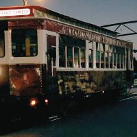 The Haunted Trolley passes under the school archway