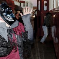 This masked zombie scares riders on the Heritage Express