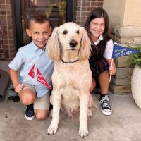 Hudson and Peyton Halley pose with their dog