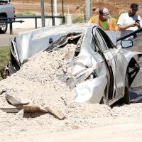 This photo shows the damage to the sedan