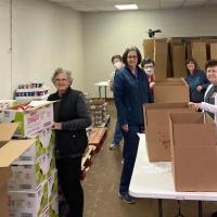 Volunteers boxed food last year for the Families with Children Food Program