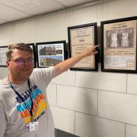 Brian Rukes points out a Class of 1898 photo