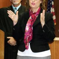 Jack McCurdy congratulates retiring bailiff Tammy Perando