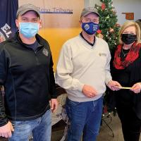 Jay Hrencher and John Michalicka present Donna Dyer with a check