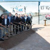 City and state officials lift shovels of dirt in a ceremonial groundbreaking at the Filling Station