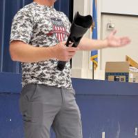Dallas Curtis showing EHS students a prosthetic leg made from a 3D Printer