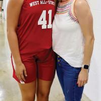 Emma Stover poses for a photo with OHS coach Haley Mitchell