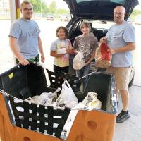 Volunteers unload non-perishable food donations