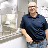 John Smith stands outside the clean lab