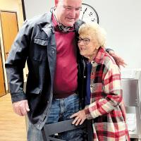 Steve Jensen shares a hug with Millie Sullens