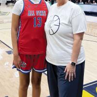 Eryn Roman Nose takes a photo with head coach Jennifer Douglas before the All-State game