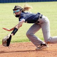 Lliana Ashford tries to backhand a ground ball