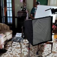 An extra waits for the camera crew to set up a scene
