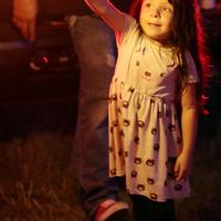 Isabelle Arias stares at a sparkler