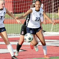 Ja’Niya Loreto chases down a loose ball in front of the EHS goal