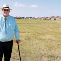 Jack Bryant stands on property RCC plans to transform into a soccer and softball complex