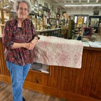 Jane Noland with donated quilt