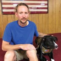  Jason Gipson with his service dog, Dale
