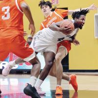 Jayden Forrest (4) gets tripped on a drive to the basket