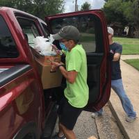  Jeff Koos helps with the most recent food distribution