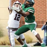 Jenks High School junior safety Joey Havir attempts to knock away a pass