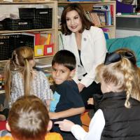 Joy Hofmeister listens to kindergarten students tell their names