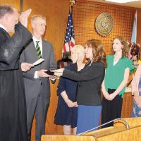 Judge Erin Jones-Slatev recites the oath of office