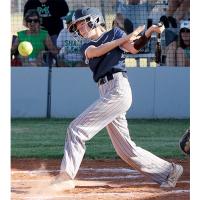 Kaydence Pawnee slaps the ball into play down the third-base line.