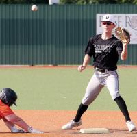 Kyler Thiessen eyes a pickoff throw