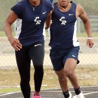 Latin Everheart (right) hands off the baton to Elijah Fisher